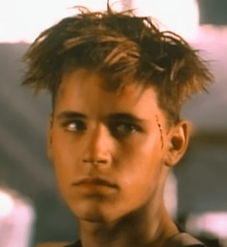 A picture of Corey Haim as Griffin with VERY bad hair.