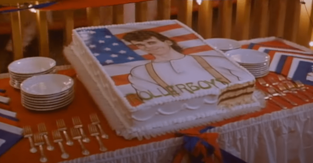 A picture of a Rollerboy cake at Gary Lee's big birthday party bash. It has a Rollerboy with a brown curly mullet standing in front of the American flag.